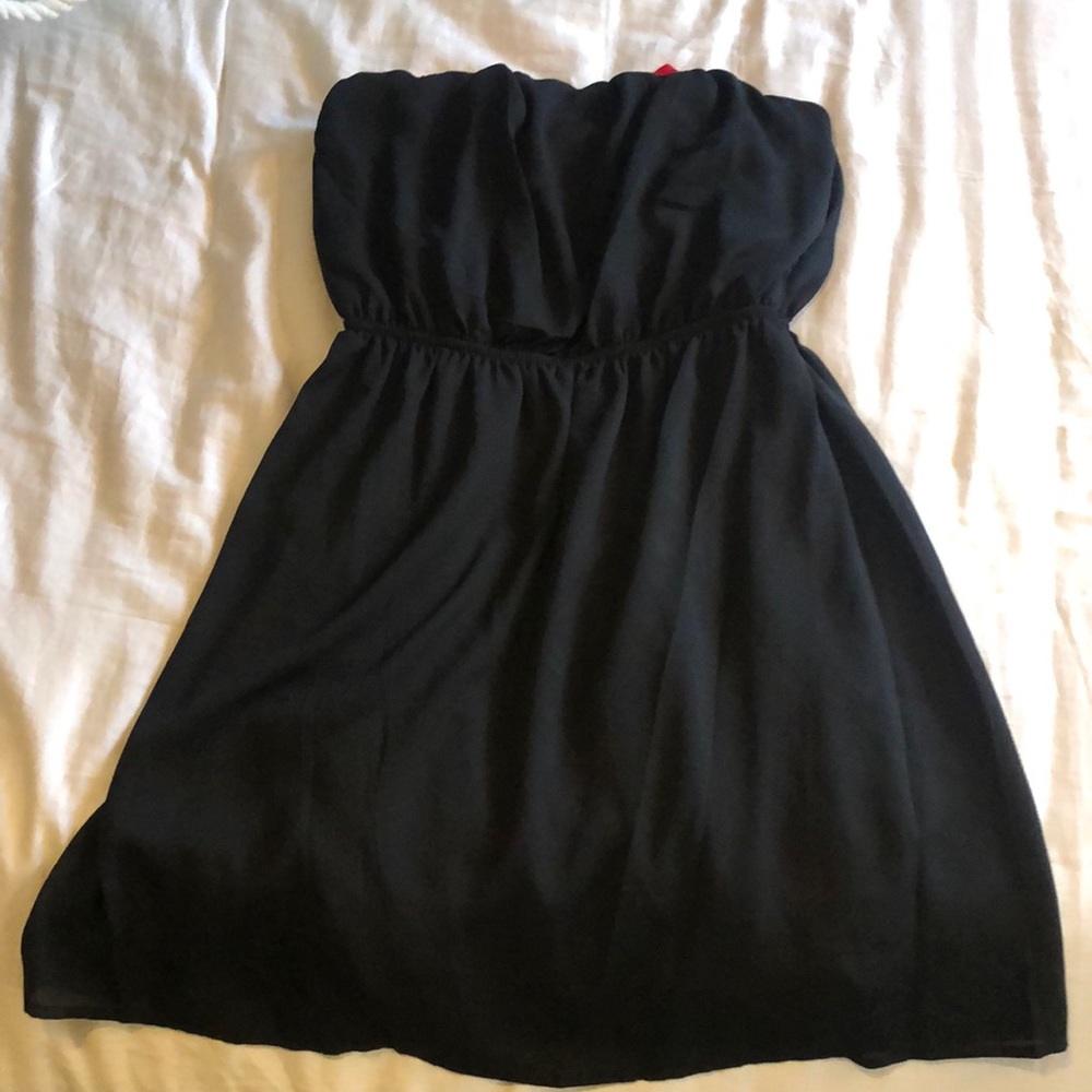 Black strapless dress with red bow